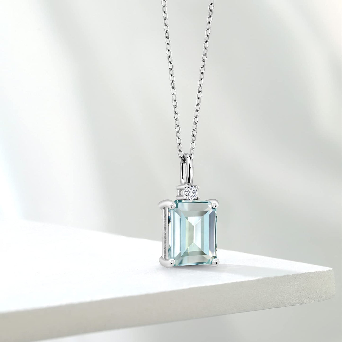 Gem Stone King 925 Silver Sky Blue Simulated Aquamarine and White Lab Grown Diamond Pendant Necklace For Women (4.27 Cttw, Gemstone Birthstone, Emerald Cut 10X8MM with 18 Inch Silver Chain)