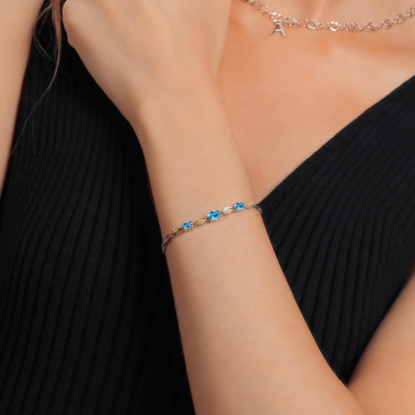 Gem Stone King 925 Silver and 10K Yellow Gold Swiss Blue Topaz and White Lab Grown Diamond Bracelet For Women (2.16 Cttw, Gemstone November Birthstone, Oval, Wheat Chain, 7 Inches)