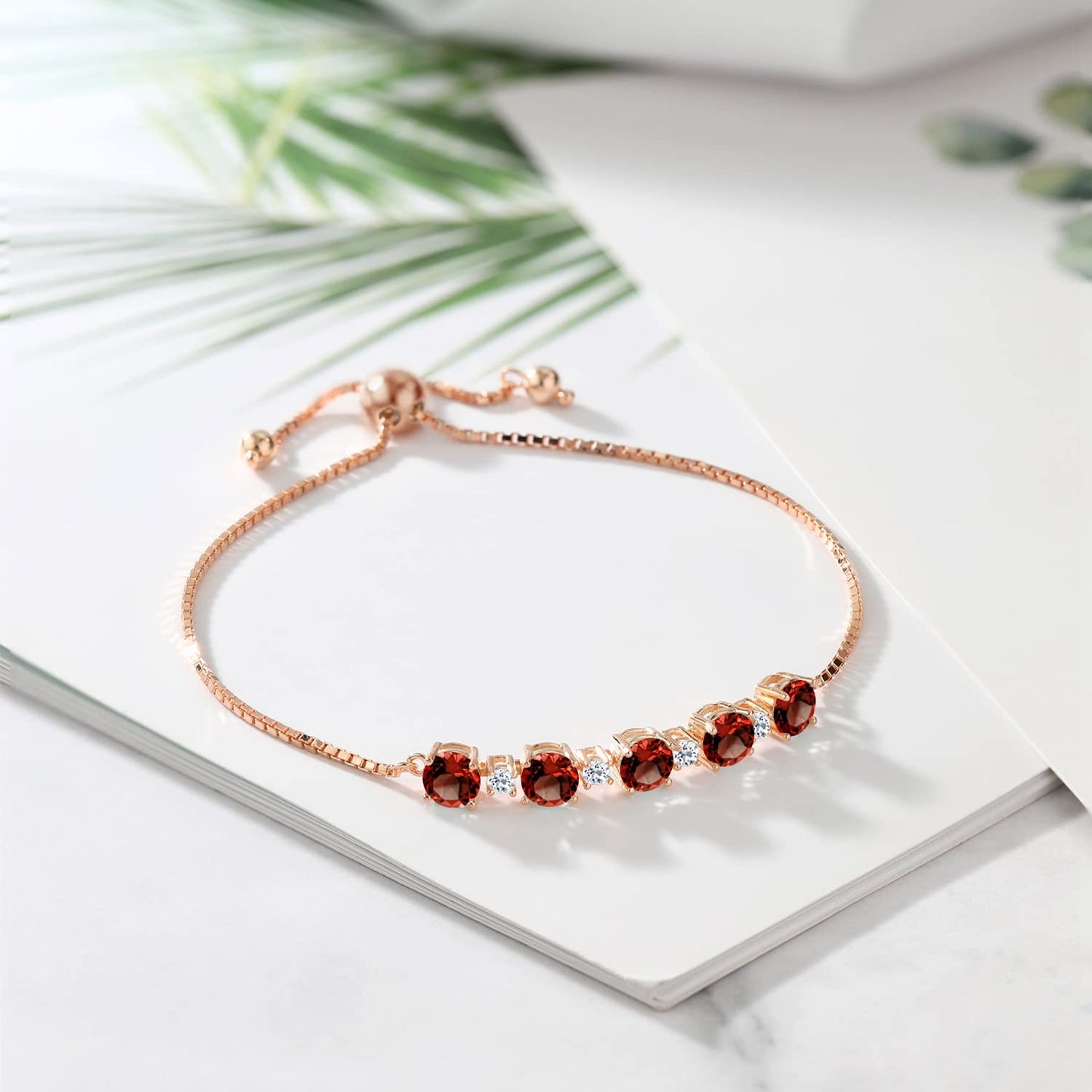 Gem Stone King 18K Rose Gold Plated Silver Red Garnet and White Topaz Tennis Bracelet For Women (5.34 Cttw, Gemstone Birthstone, Fully Adjustable Up to 9 Inch)