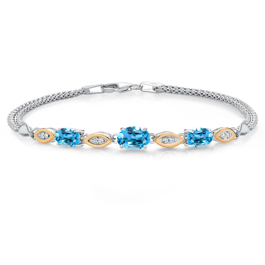 Gem Stone King 925 Silver and 10K Yellow Gold Swiss Blue Topaz and White Lab Grown Diamond Bracelet For Women (2.16 Cttw, Gemstone November Birthstone, Oval, Wheat Chain, 7 Inches)