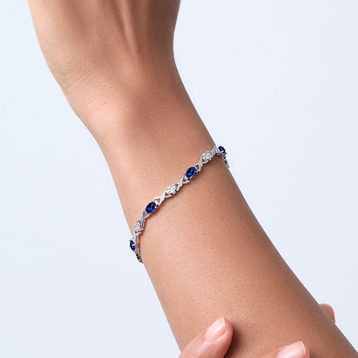 Gem Stone King 925 Sterling Silver Blue Created Sapphire Tennis Bracelet For Women (4.80 Cttw, Gemstone September Birthstone, Oval 6X4MM, 7 Inch)