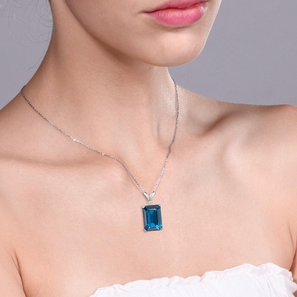 Gem Stone King 925 Sterling Silver London Blue Topaz and White Diamond Pendant Necklace For Women (9.52 Cttw, Gemstone Birthstone, Emerald Cut 14X10MM, with 18 Inch Silver Chain)