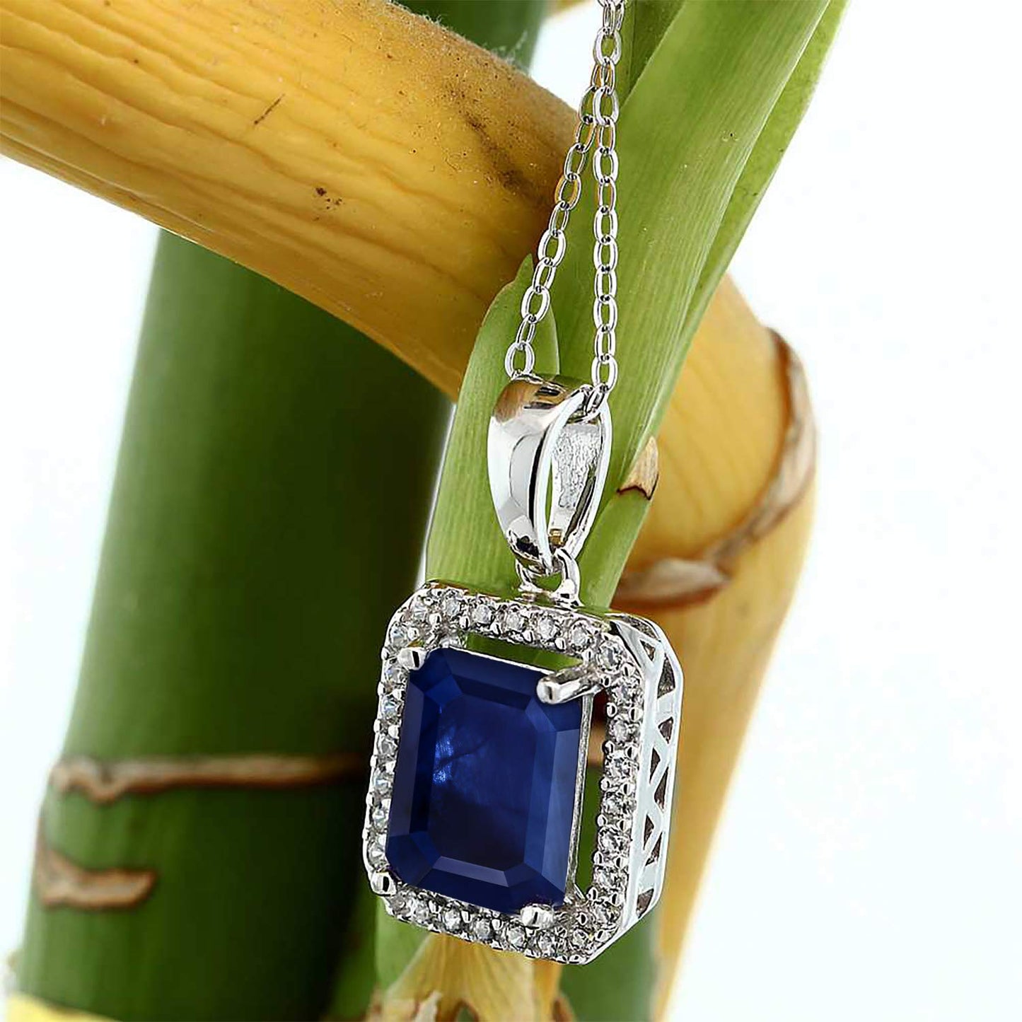 Gem Stone King 925 Sterling Silver Gemstone Birthstone Halo Necklace | Emerald Cut 9X7MM | Halo Pendant Necklace for Women | with 18 Inch Silver Chain