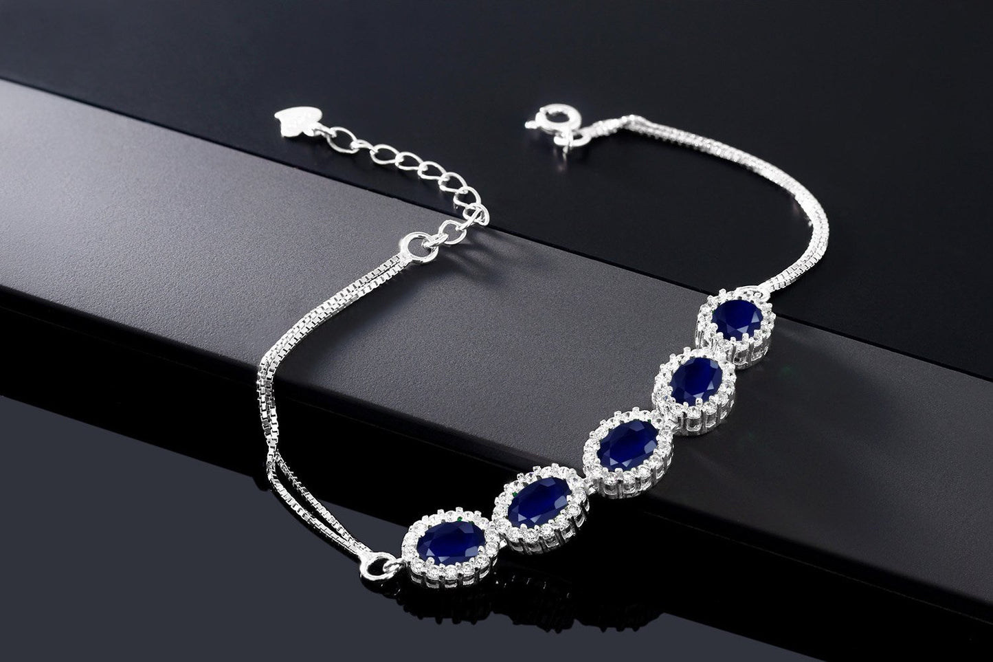 Gem Stone King 925 Sterling Silver Blue Sapphire Tennis Bracelet For Women (6.14 Cttw, Gemstone Birthstone, Center Stones: 7X5MM, 7 Inch + 1.5 inch Extender)