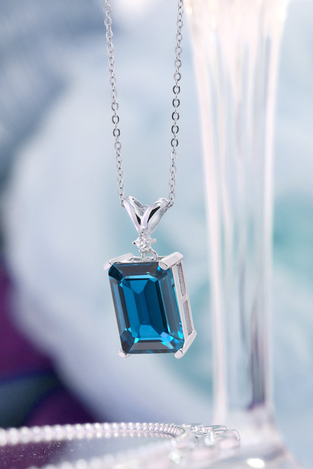 Gem Stone King 925 Sterling Silver London Blue Topaz and White Diamond Pendant Necklace For Women (9.52 Cttw, Gemstone Birthstone, Emerald Cut 14X10MM, with 18 Inch Silver Chain)