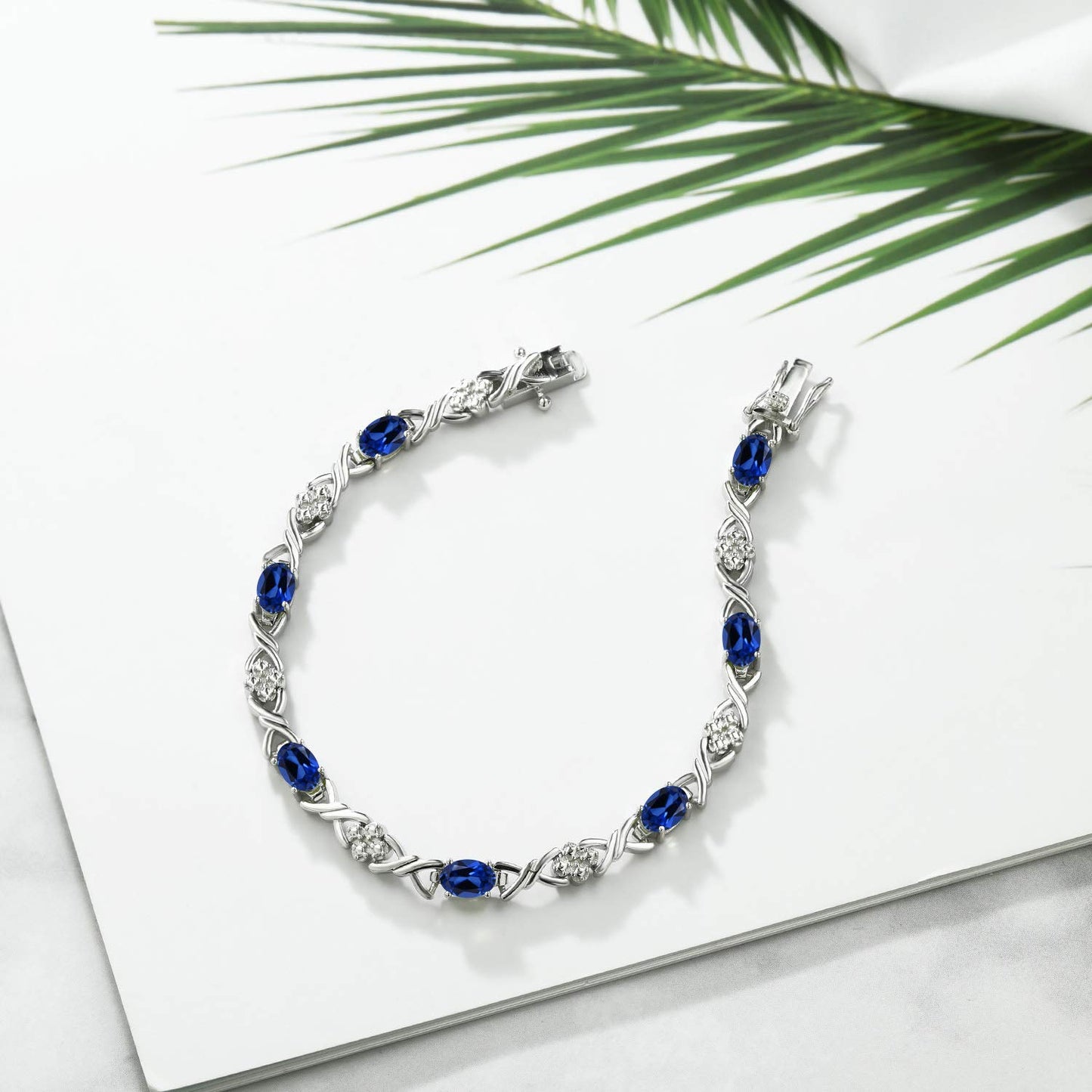 Gem Stone King 925 Sterling Silver Blue Created Sapphire Tennis Bracelet For Women (4.80 Cttw, Gemstone September Birthstone, Oval 6X4MM, 7 Inch)