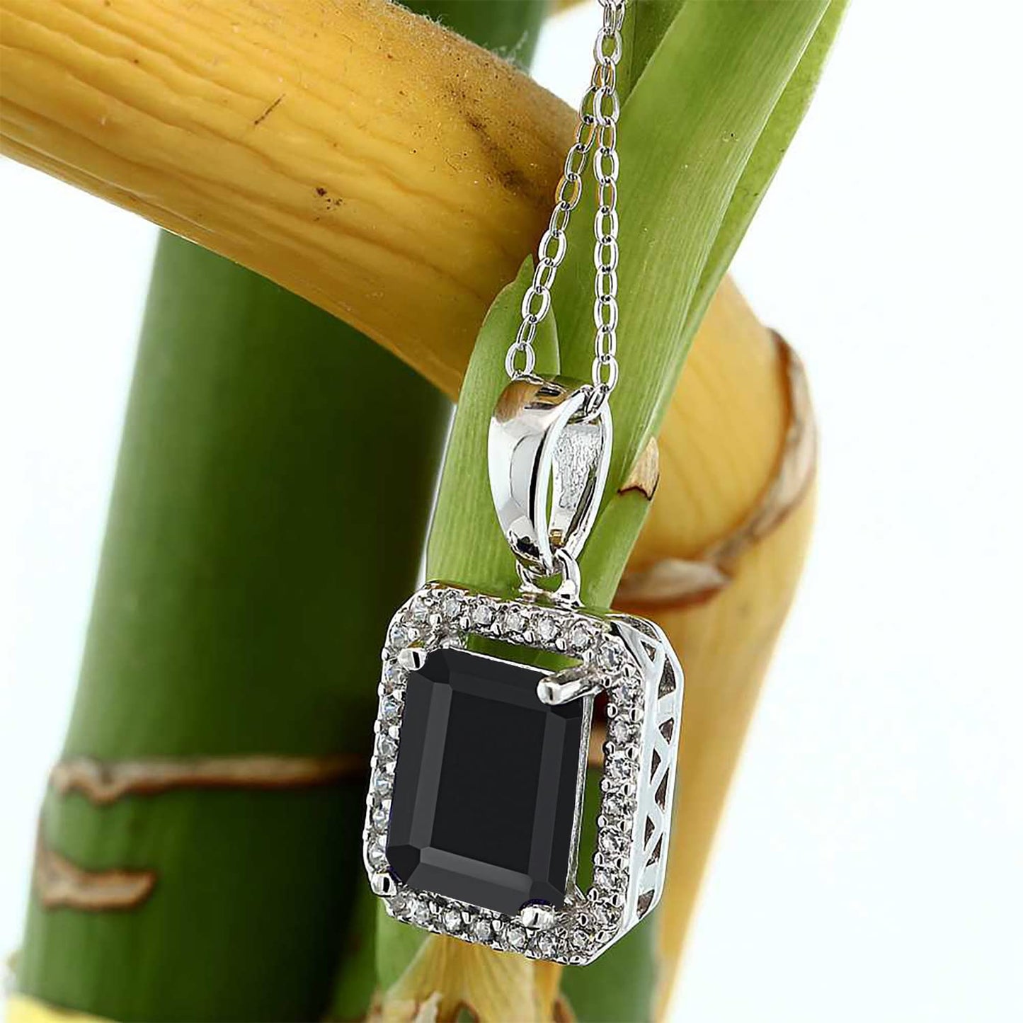 Gem Stone King 9X7MM Emerald Cut Gemstone Birthstone and White Moissanite Halo Pendant Necklace For Women | 925 Sterling Silver | With 18 Inch Silver Chain