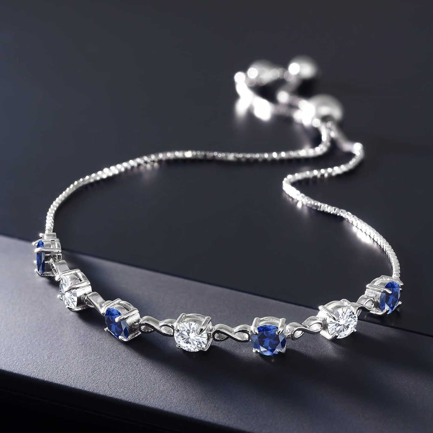 Gem Stone King 925 Sterling Silver Round Blue Created Sapphire and White Moissanite Tennis Bracelet For Women (2.39 Cttw, Gemstone September Birthstone, Round 4.5MM, Fully Adjustable Up to 9 Inch)